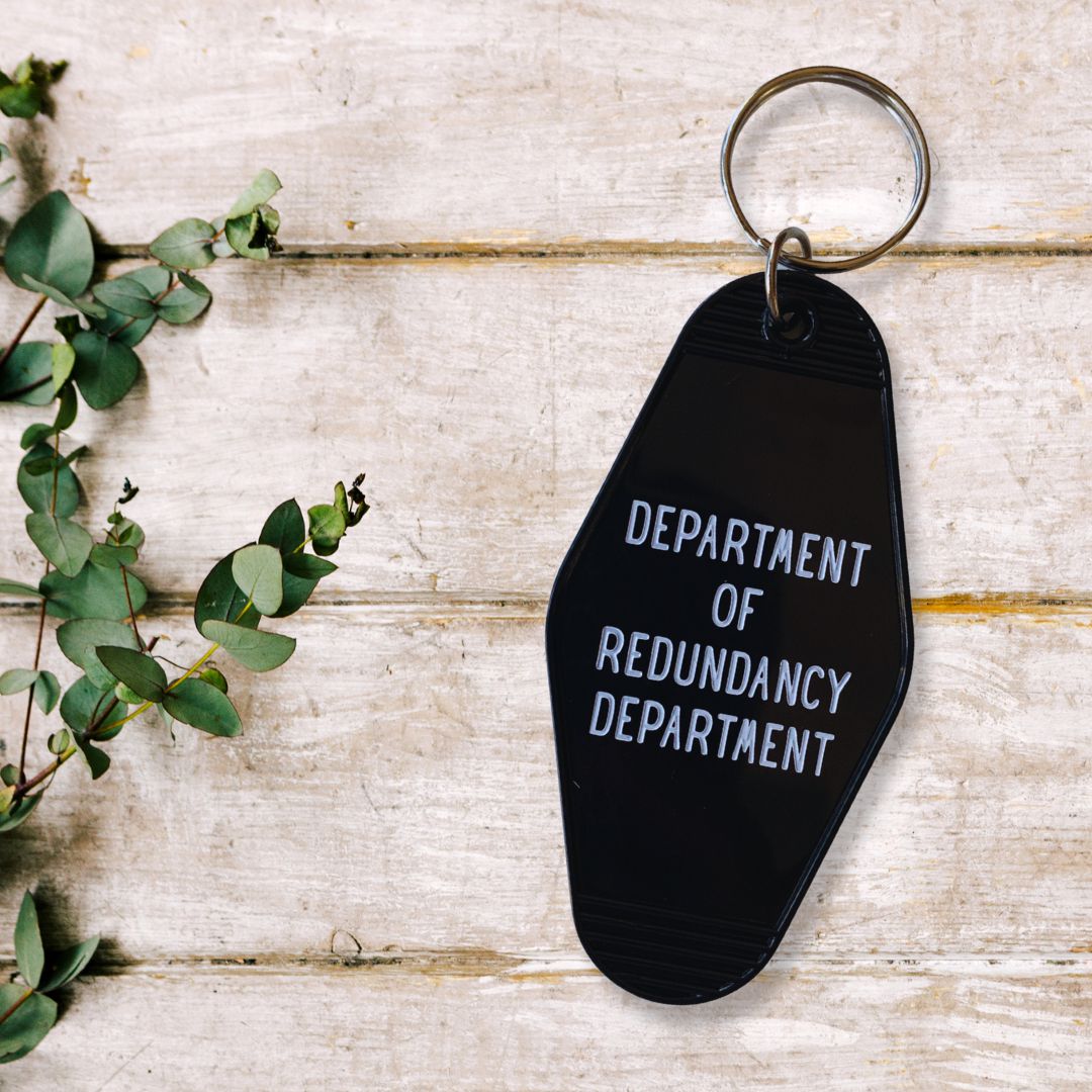 Department of Redundancy Department Motel Style Keychain in Black